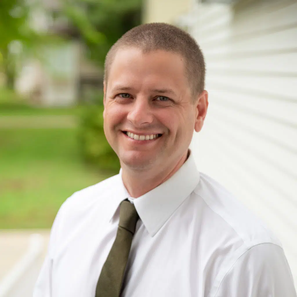 Dr. Moody, dentist in Troy, smiling for a picture at his dental office, Market Street family dental.