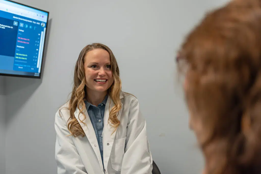 dental implant doctor with patient in troy il