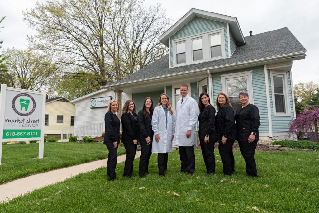Dentist in Troy, IL with her dental team in front of the office